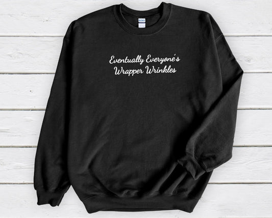 Black gildan sweatshirt saying eventually everyone's wrapper wrinkles