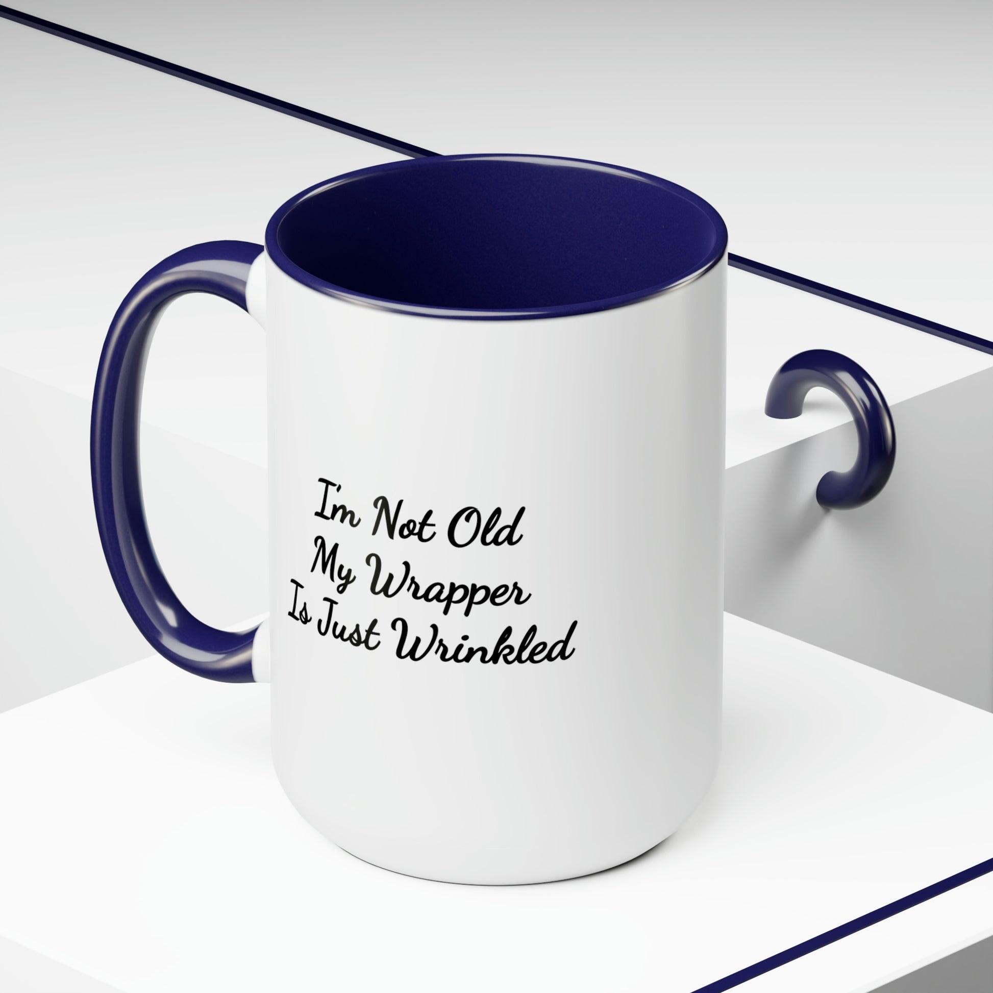 dark blue accent coffee mug saying I'm not old my wrapper is just wrinkled