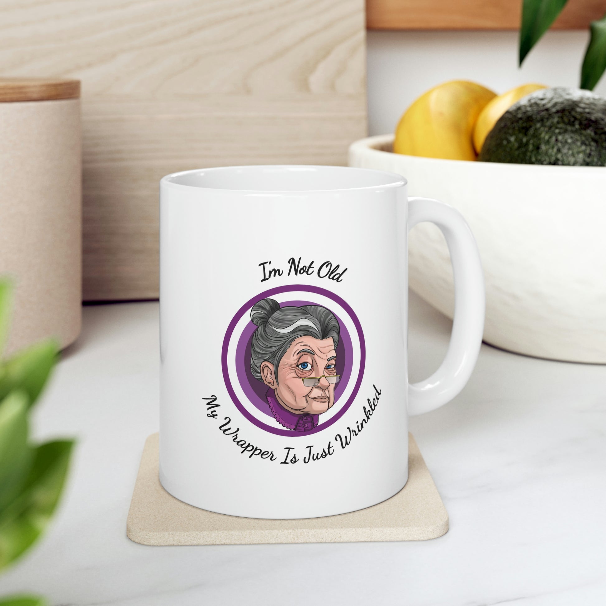 white 11oz mug with purple graphic saying i'm not old my wrapper is just wrinkled