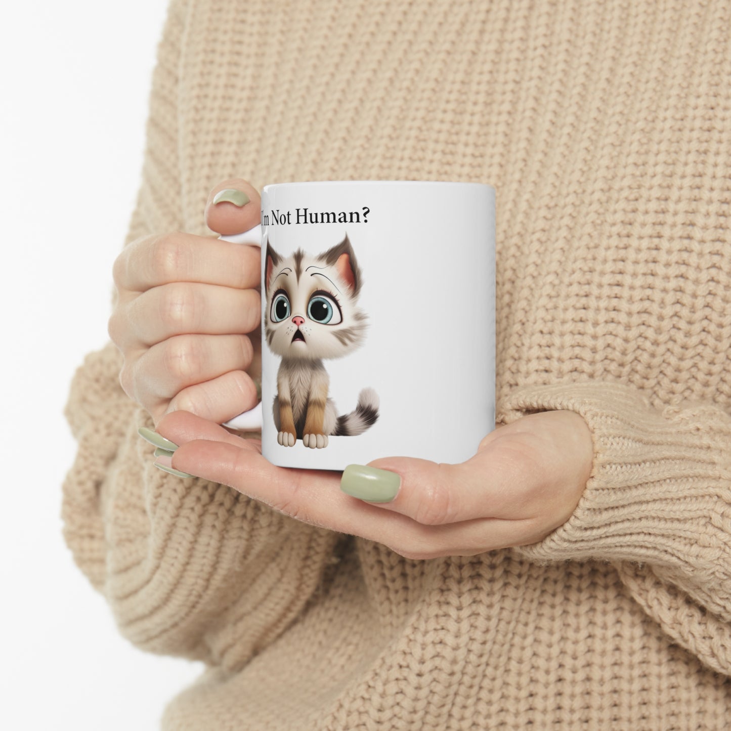 sad kitten graphic on coffee mug saying I'm not human?