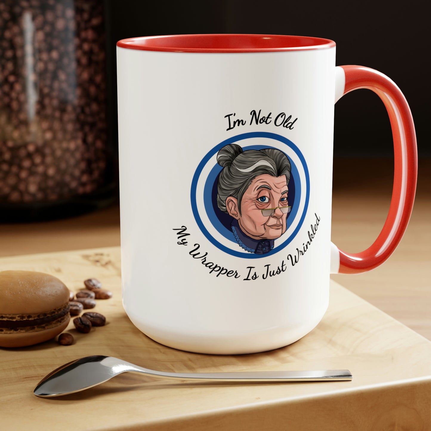 red accent coffee mug with old lady picture saying I'm not old my wrapper is just wrinkled