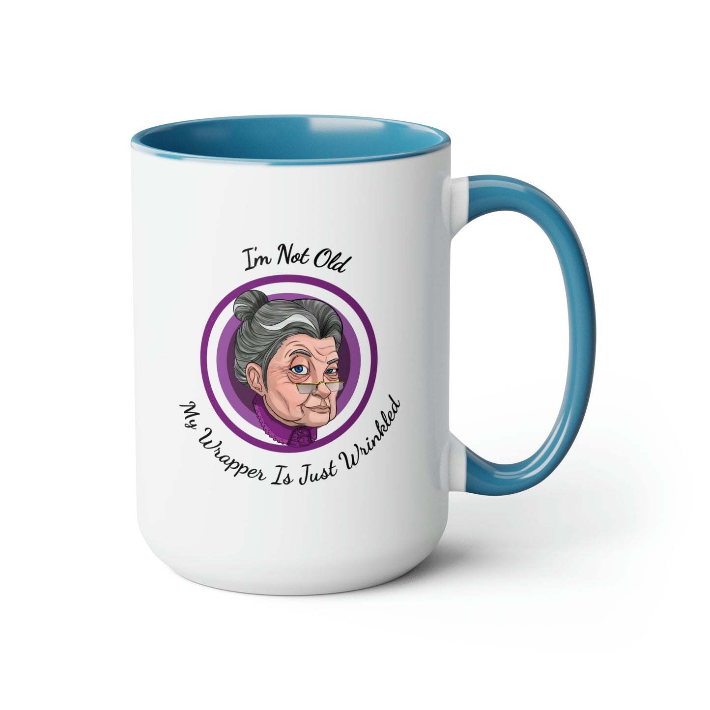 blue two tone coffee mug with purple logo saying I'm not old my wrapper is just wrinkled