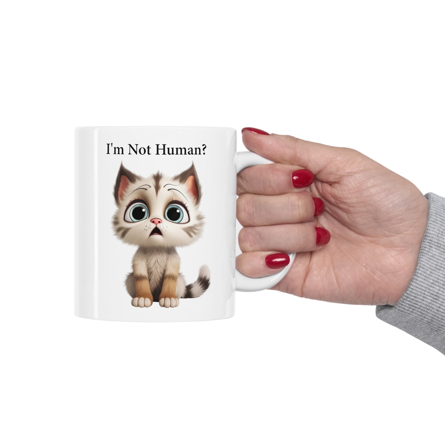 sad kitten graphic on coffee mug saying I'm not human?