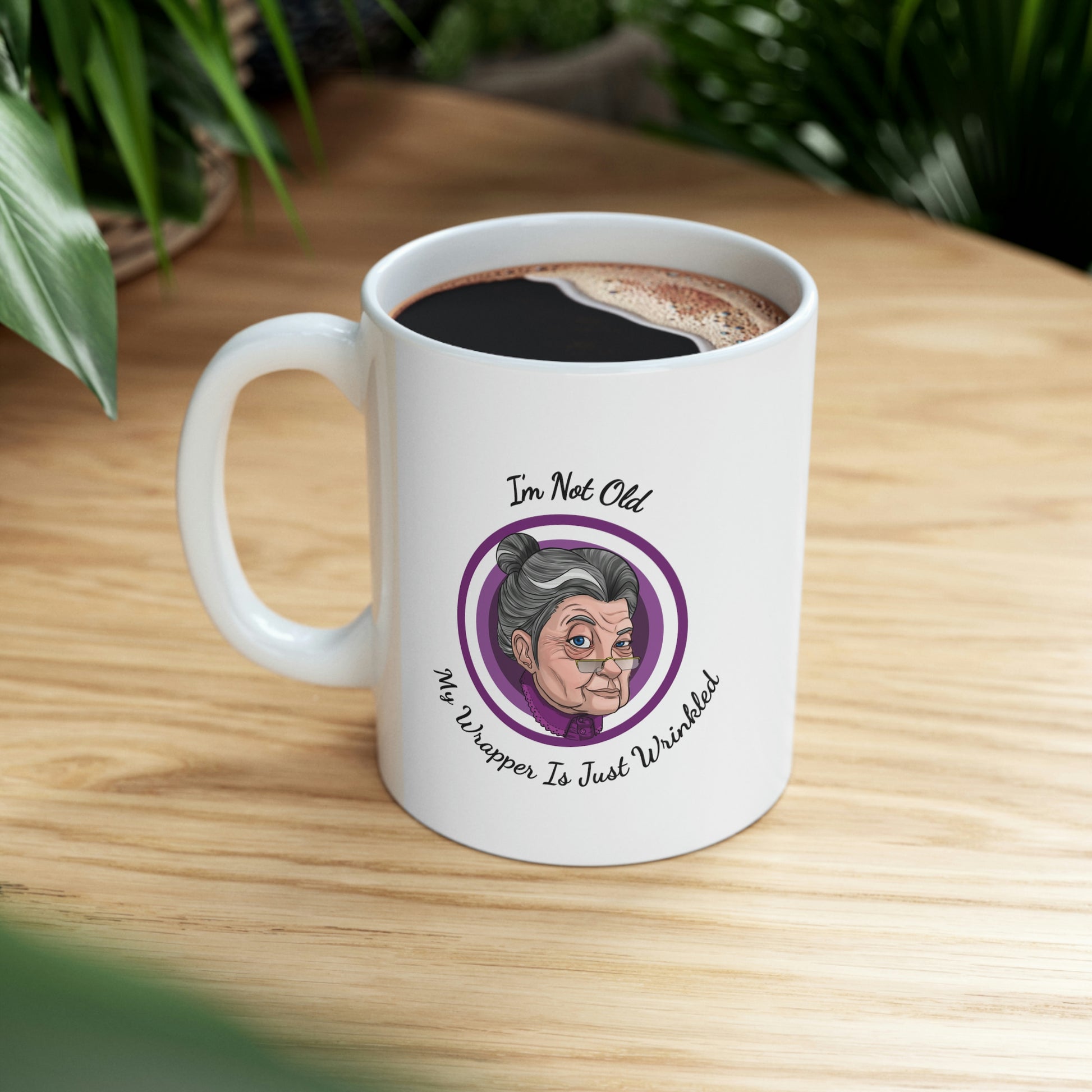 white 11oz mug with purple graphic saying i'm not old my wrapper is just wrinkled