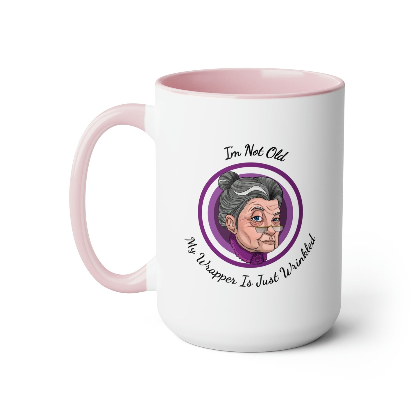 pink two tone coffee mug with purple logo saying I'm not old my wrapper is just wrinkled