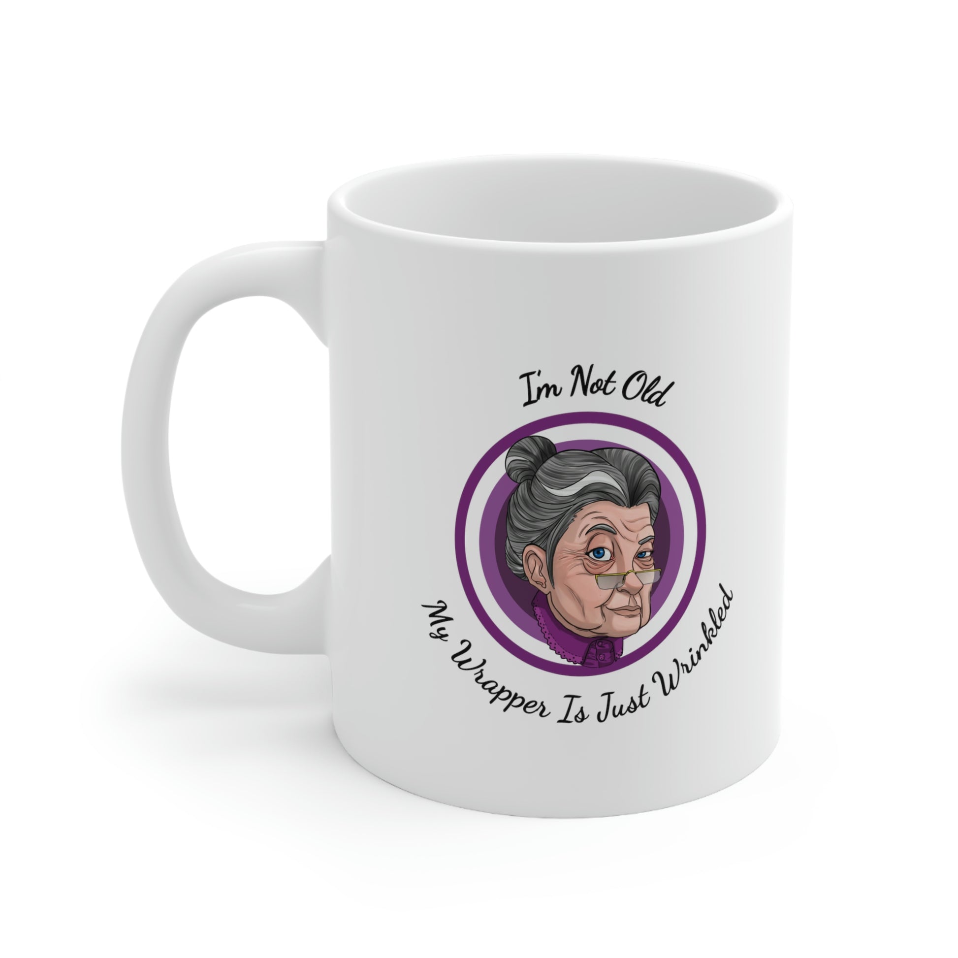 white 11oz mug with purple graphic saying i'm not old my wrapper is just wrinkled