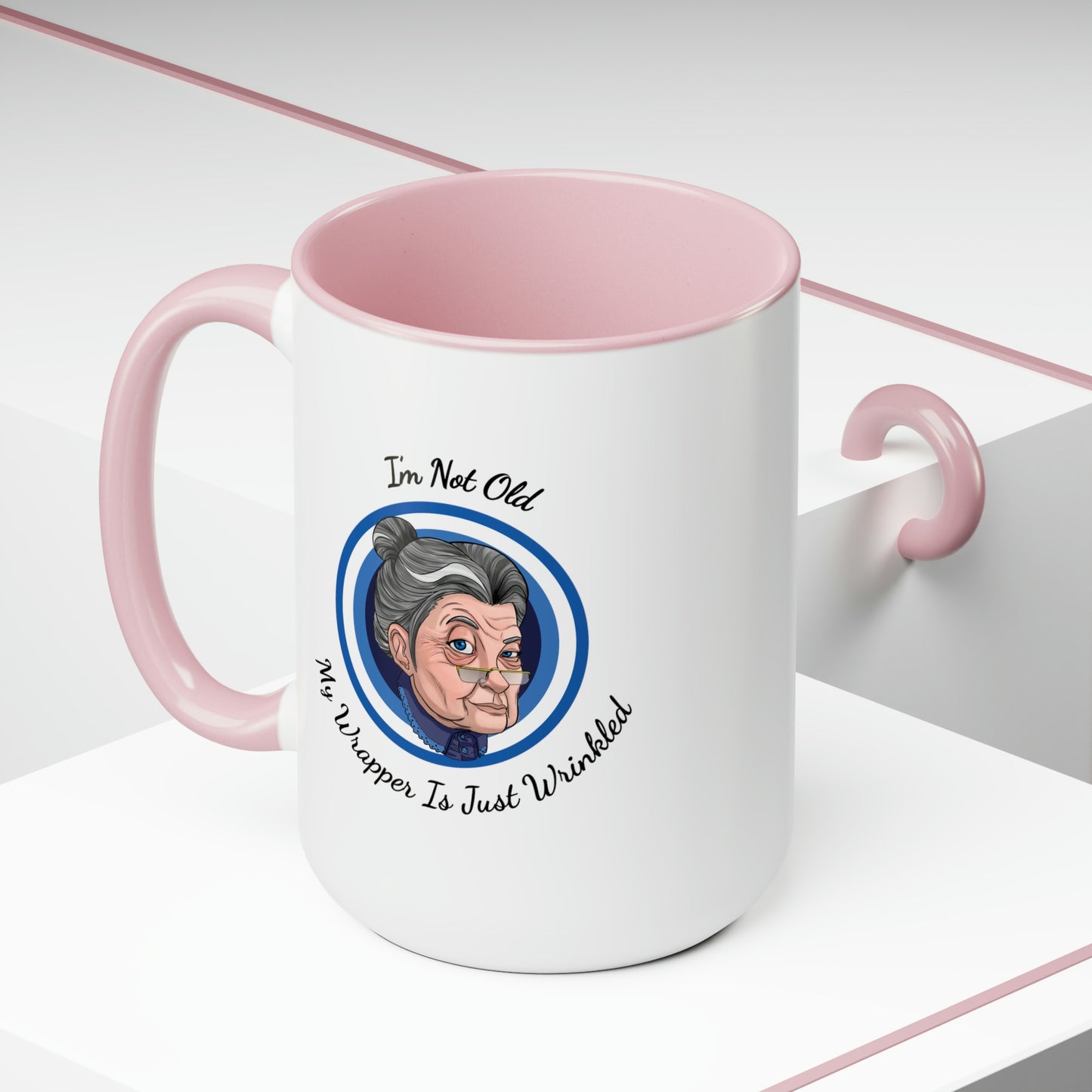 pink accent coffee mug with old lady picture saying I'm not old my wrapper is just wrinkled