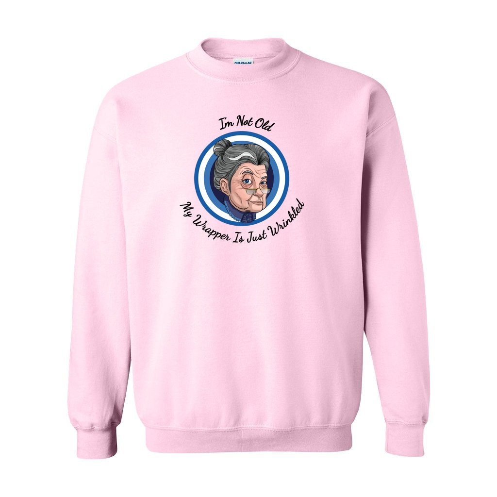 Pink Gildan sweatshirt with blue logo saying I'm not old my wrapper is just wrinkled